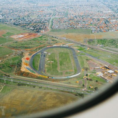 Wide window view of a calm city park.